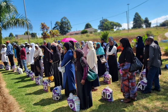 Recipients receiving Zakat funds and supplies from AshrafulAid