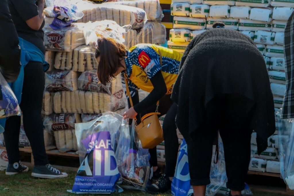 AshrafulAid volunteers packing grocery bags for distribution