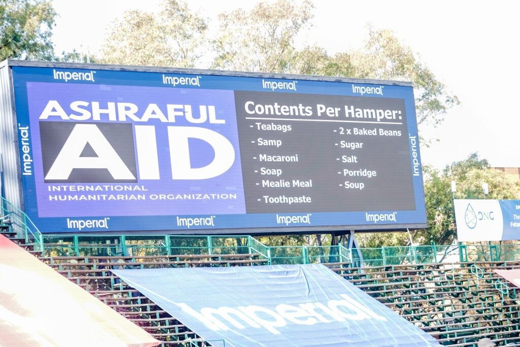 AshrafulAid promoting gift hampers on Mandela Day via stadium billboard
