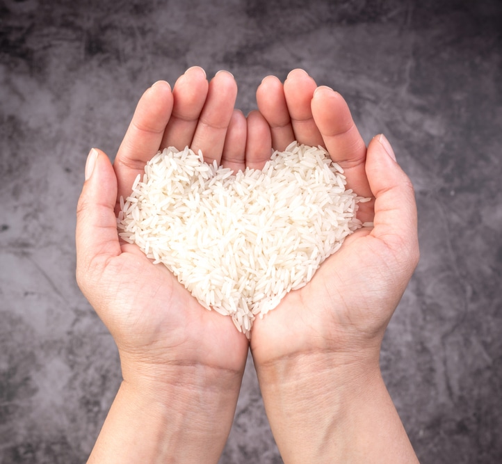 Zakaat concept: giving rice from your hands with love and care